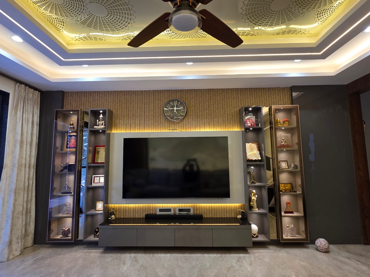 Living room colour palette — warm neutrals with gold accents — DesigningAxis by Shivani