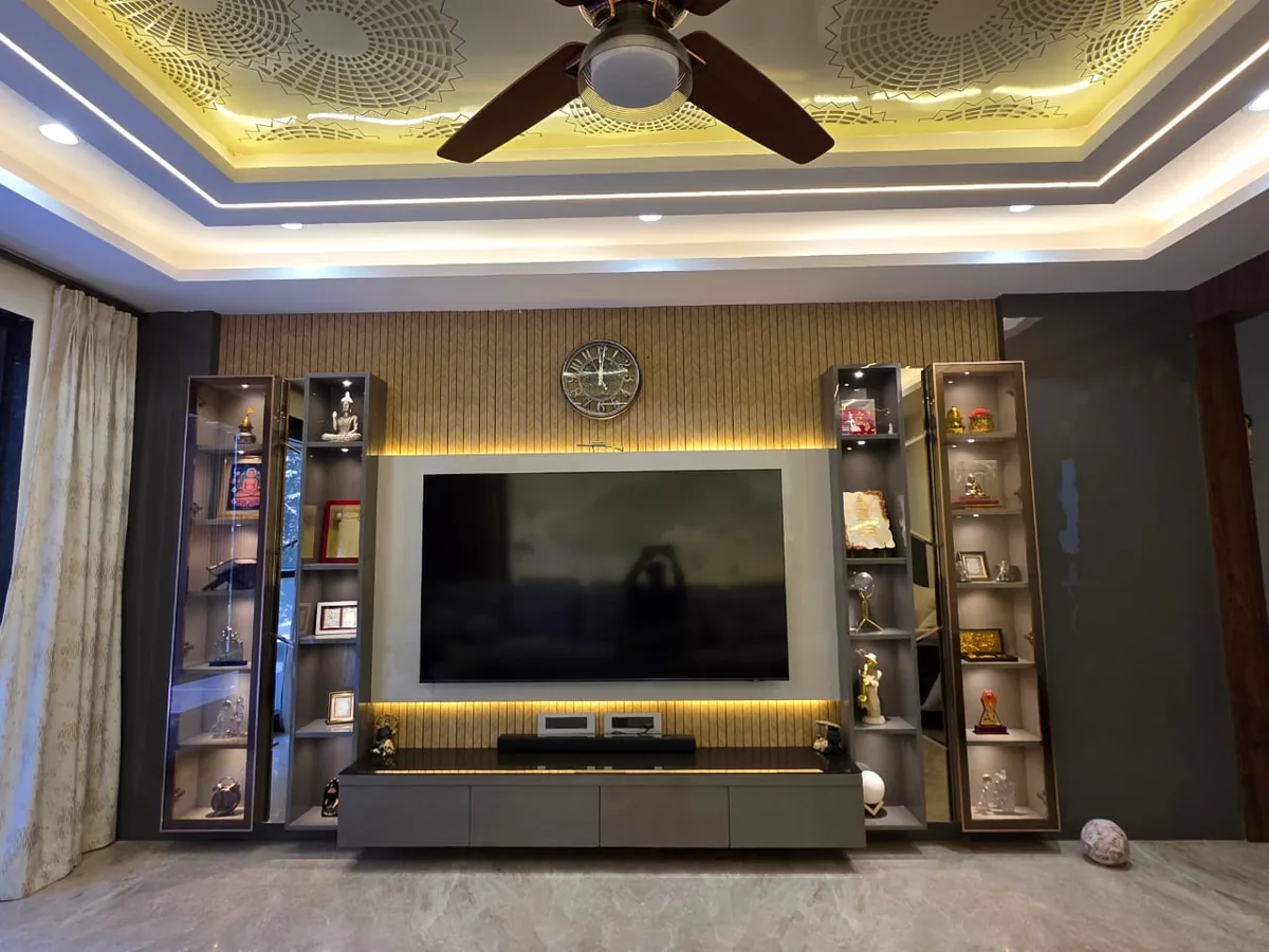 Living room colour palette — warm neutrals with gold accents — DesigningAxis by Shivani