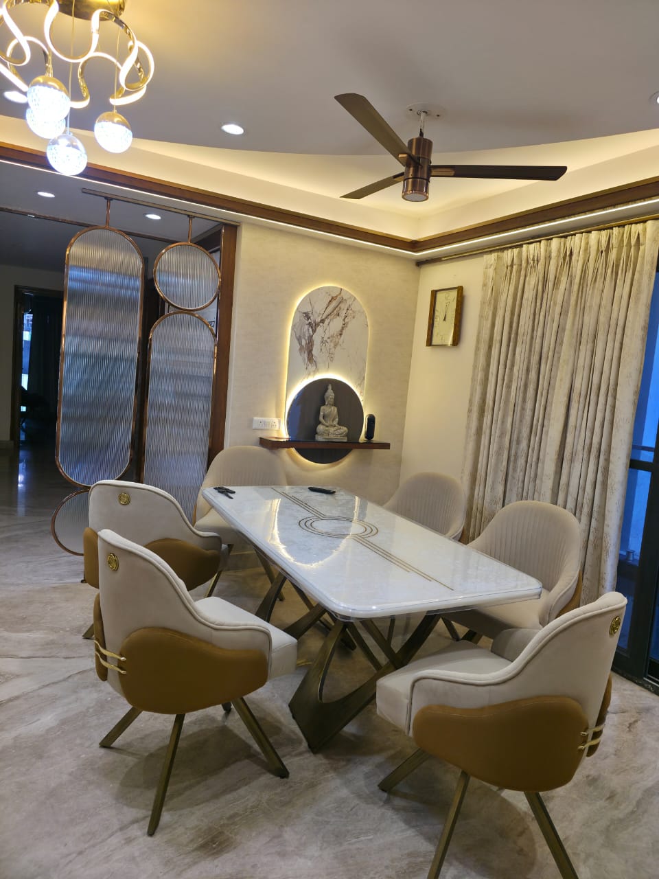 Luxury dining room with marble table and designer chandelier, Delhi NCR
