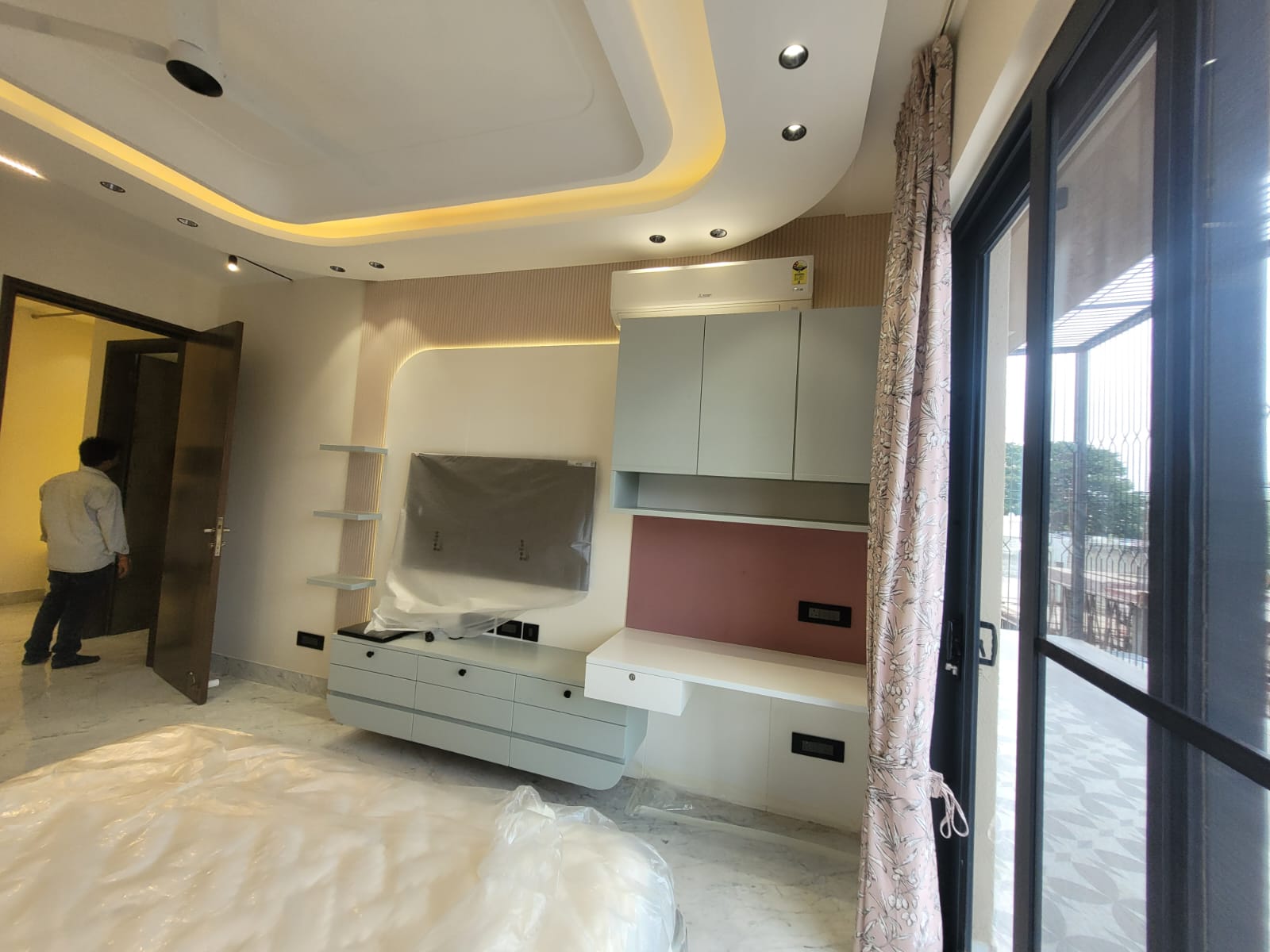 Custom pooja room with carved arch and backlit design, Ghaziabad